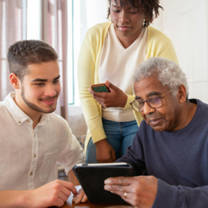 Adults engaged in a supportive group activity, demonstrating Positive Behaviour Support.